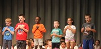 students participating in first grade show