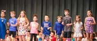 students participating in first grade show