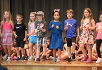 students participating in first grade show
