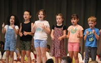 students participating in first grade show