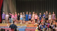 students participating in first grade show