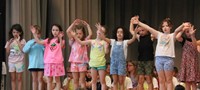 students participating in first grade show