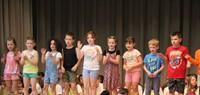 students participating in first grade show