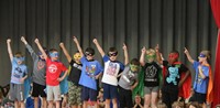 students participating in first grade show