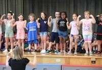 students participating in first grade show