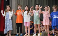 students participating in first grade show