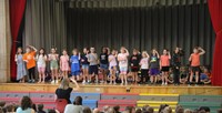 students participating in first grade show