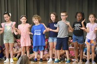 students participating in first grade show