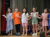students participating in first grade show