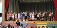 students participating in first grade show