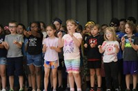 students participating in first grade show