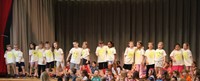 students participating in first grade show