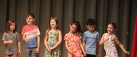 students participating in first grade show