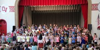 students participating in first grade show
