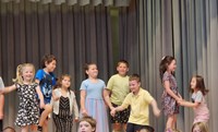 students participating in first grade show