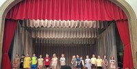 students participating in first grade show