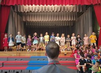 students participating in first grade show