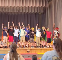 students participating in first grade show