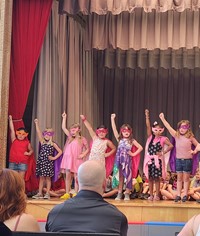 students participating in first grade show