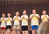 students participating in first grade show