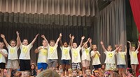 students participating in first grade show