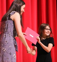 people at fifth grade moving up ceremony
