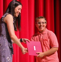 people at fifth grade moving up ceremony