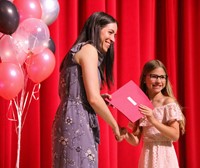 people at fifth grade moving up ceremony
