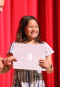 people at fifth grade moving up ceremony