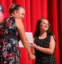 people at fifth grade moving up ceremony
