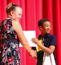 people at fifth grade moving up ceremony