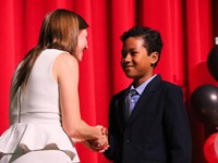people at fifth grade moving up ceremony
