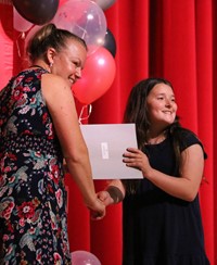 people at fifth grade moving up ceremony
