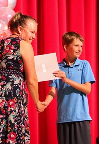 people at fifth grade moving up ceremony