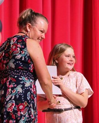 people at fifth grade moving up ceremony