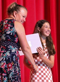 people at fifth grade moving up ceremony
