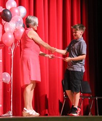 people at fifth grade moving up ceremony
