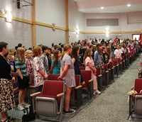people at fifth grade moving up ceremony
