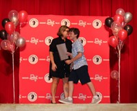 people at fifth grade moving up ceremony