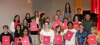 people at fifth grade moving up ceremony