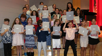 people at fifth grade moving up ceremony