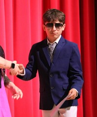 people at fifth grade moving up ceremony
