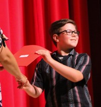 people at fifth grade moving up ceremony