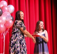 people at fifth grade moving up ceremony