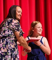 people at fifth grade moving up ceremony