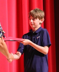 people at fifth grade moving up ceremony