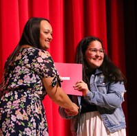 people at fifth grade moving up ceremony